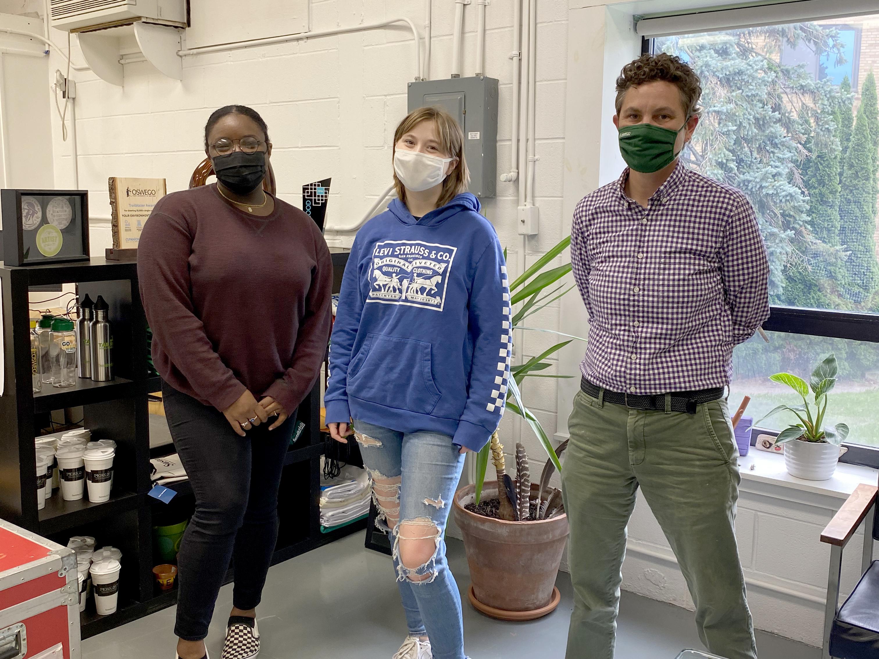 Interns and Sustainability Manager Kate Spector stand ready to help visitors to the Office of Sustainability