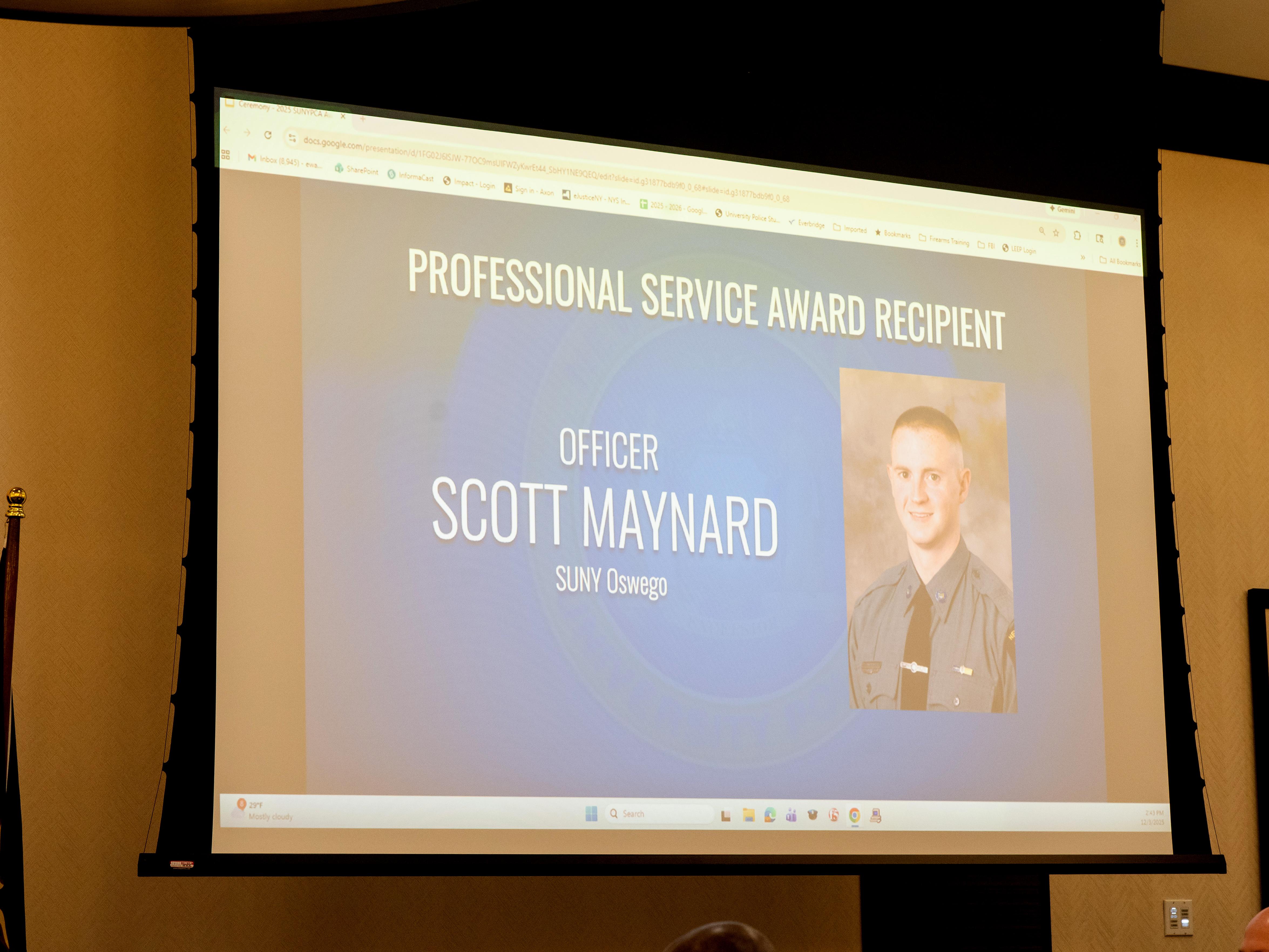 Slide showing the SUNY award presented to Officer Scott Maynard