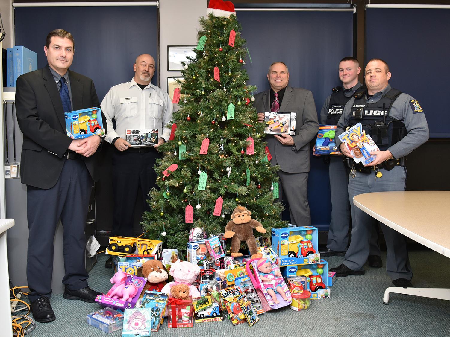 University Police with toys collected through dodgeball tournament