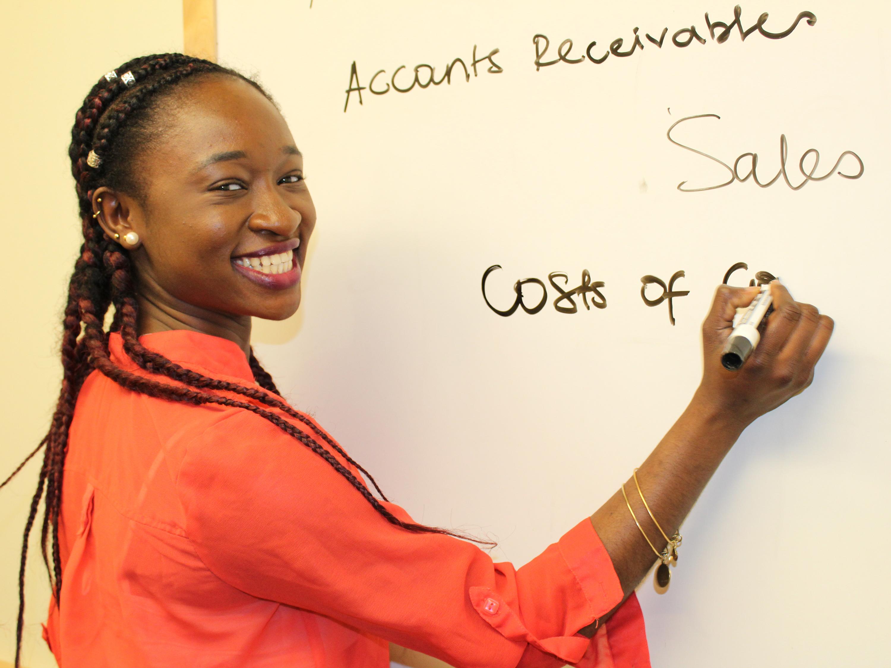 Charlene Assam writing on board