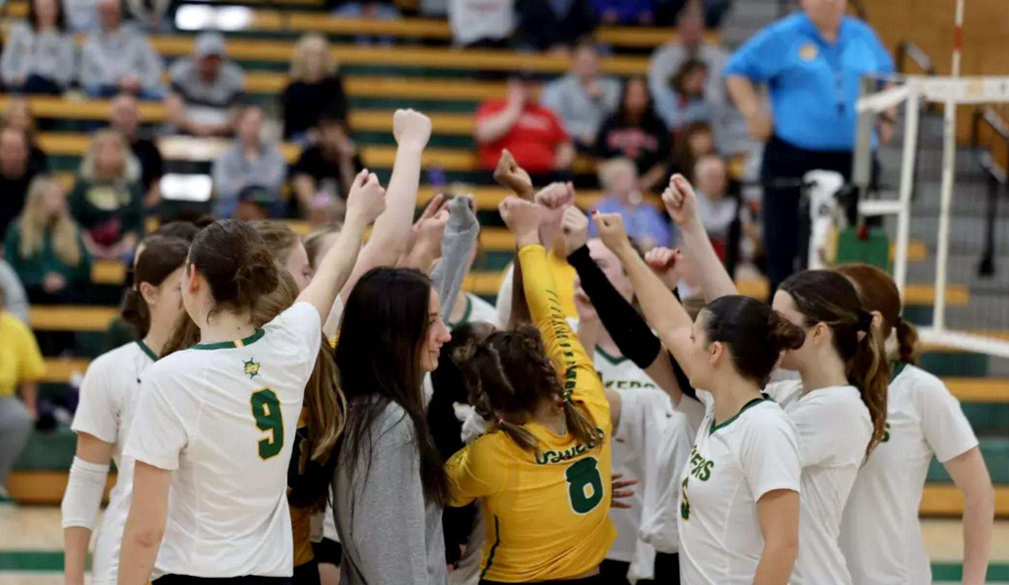 Women's volleyball team huddles up