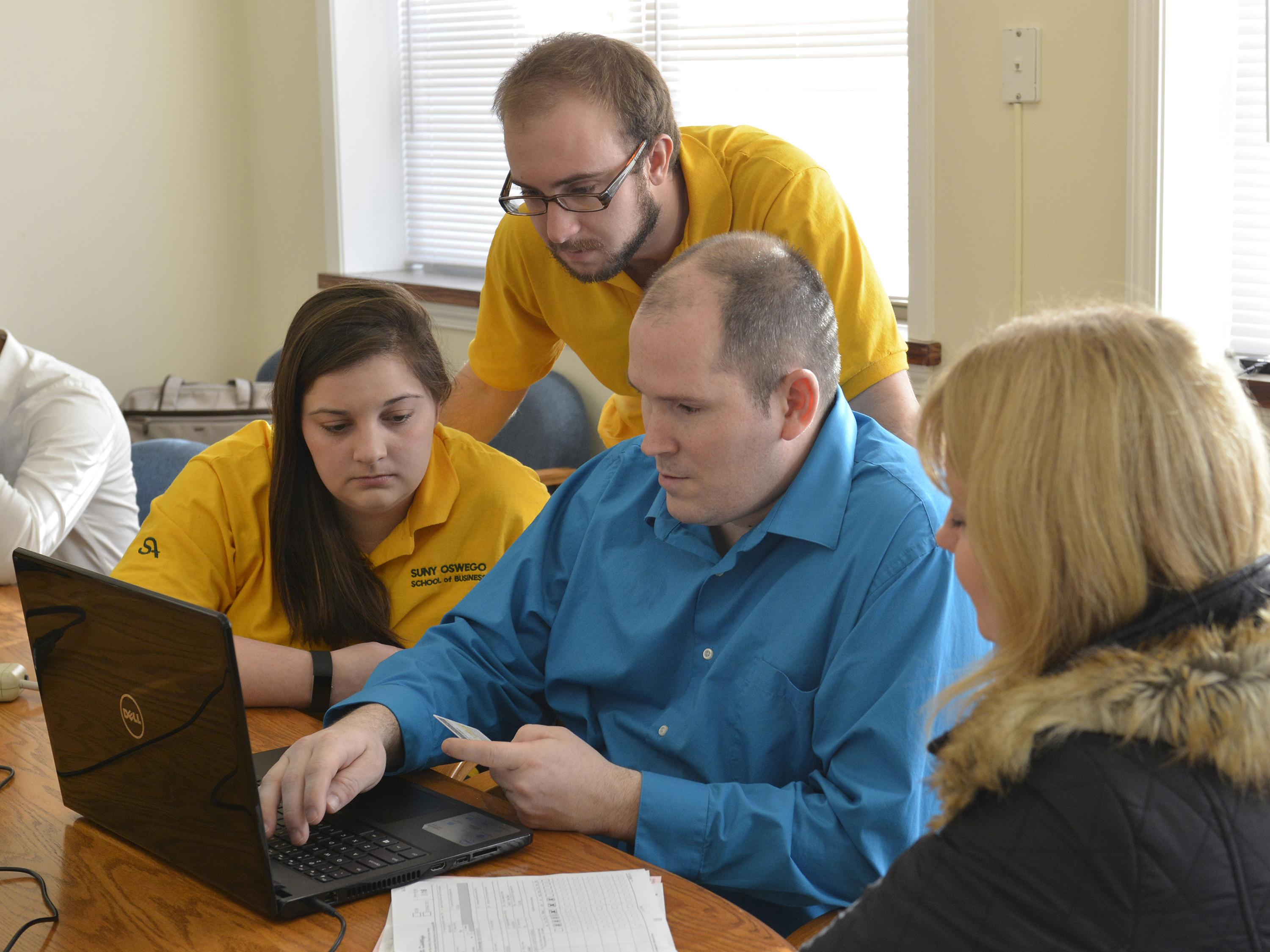 Students helping prepare taxes