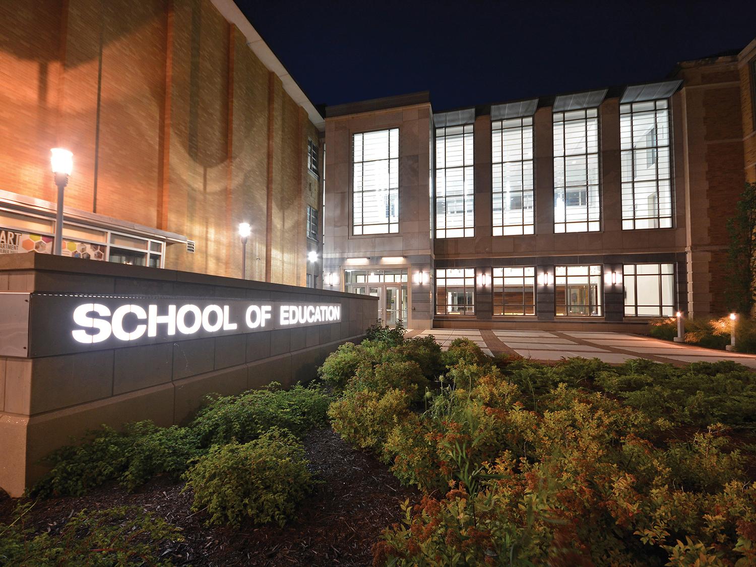 Outside of Wilber Hall, viewed lit up at night