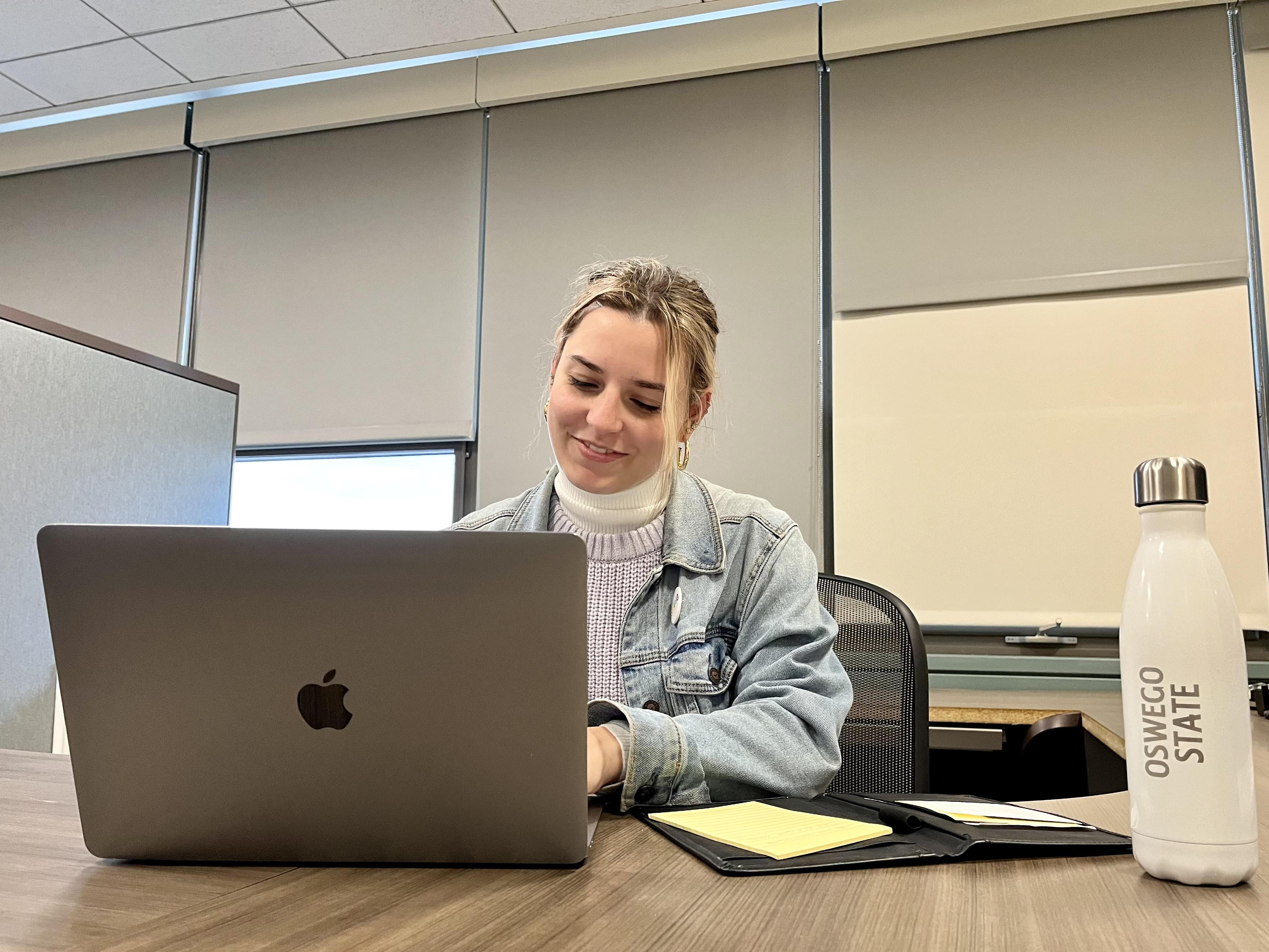 Student studying on a laptop