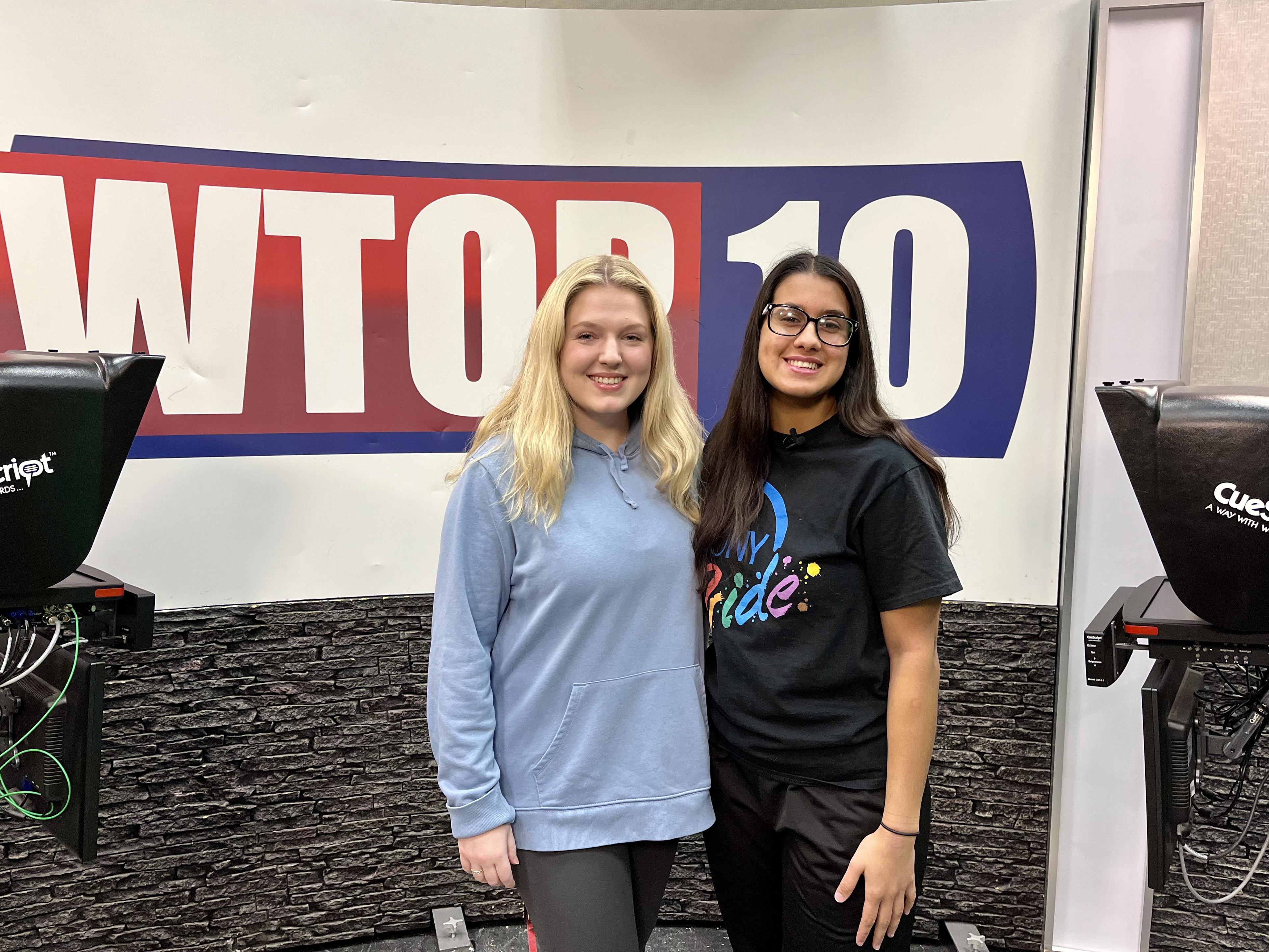Co-producers Natalie Barden (left) and Jolie Santiago (right) stand in the WTOP studio ahead of the first ever all-female WTOP sports broadcast.