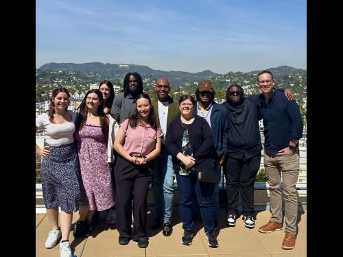 Oswego students and faculty stand in front of the Hollywood sign on their Hollywood POV trip.