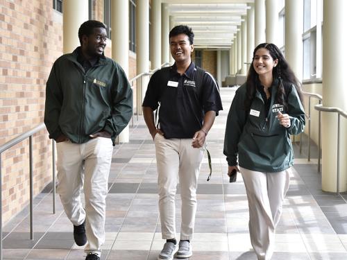 International student leaders walking through the Marano Campus Center.