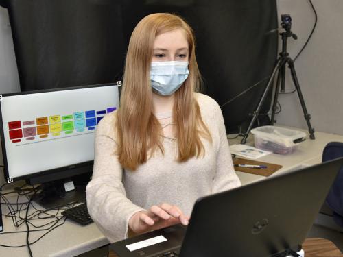 Psychology student Quinn Ceilly works in a Mahar Hall lab