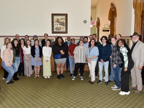 Participants and partners in the campus-community initiative ‘One City. One Campus. One Community’ gather at a May 1 reception in Oswego's City Hall