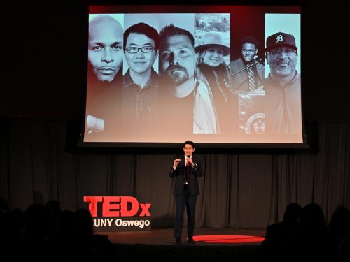 Eason Lee introduces the inaugural TEDxSUNY Oswego in April 2025