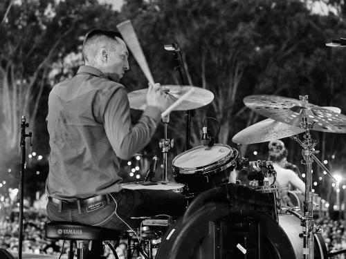Nate Felty '12 playing drums at CMC Rocks Festival in Brisbane, Australia