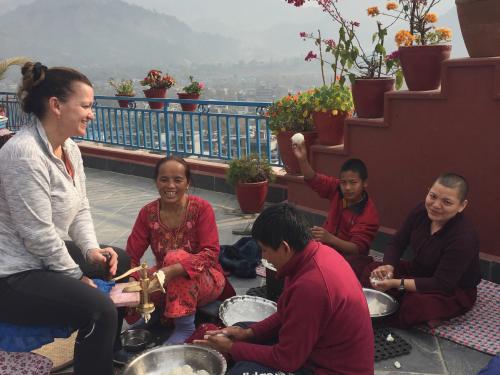 Danielle Carr with monks and family