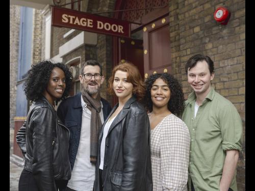 5 members of Actors from the London Stage pose outside a stage door