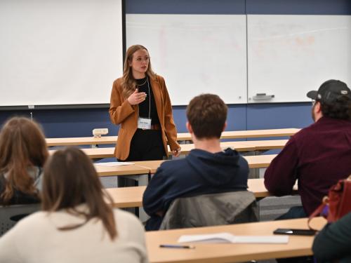 Julia Lavery Clark of Novelis, a 2018 SUNY Oswego graduate, speaks to students during the recent “AI and the Future of Work” summit.