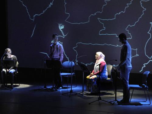 Participants take part in reading onstage for Beyond Sacred performance