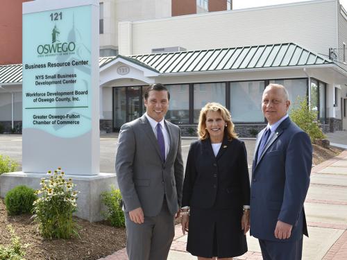 Oswego Mayor William J. Barlow Jr., SUNY Oswego President Deborah F. Stanley and Pathfinder Bank President Thomas W. Schneider, fronting the college's new Business Resource Center in Oswego