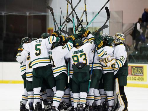 Laker men's hockey players celebrate a win