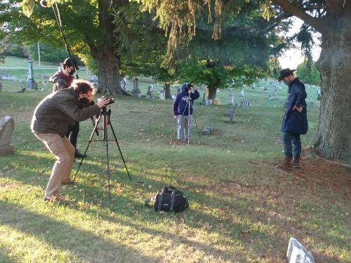 Students acting and filming cemetery storytelling