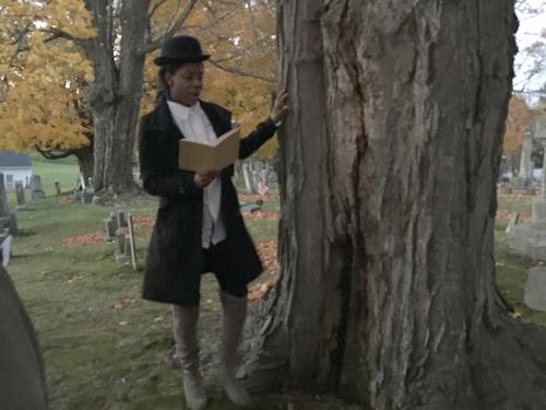 A student dressed in historical clothing telling a story