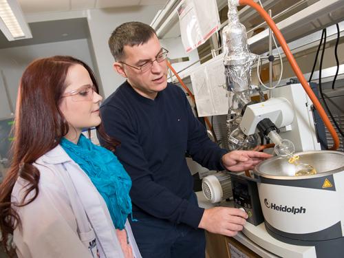 Chemistry professor, Fehmi Damkaci in lab with student