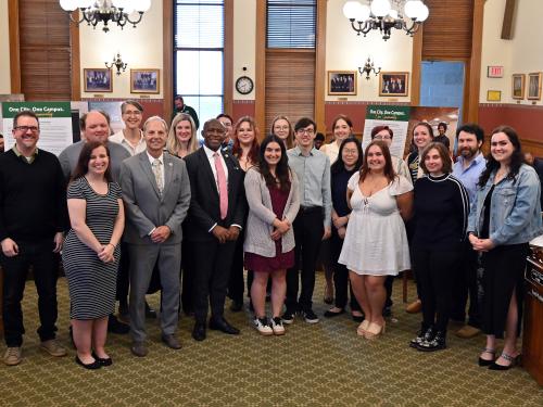 Representations of the City of Oswego and SUNY Oswego gather for an opening reception for the One City. One Campus. One Community. photojournalism project