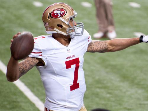 Colin Kaepernick throwing a pass