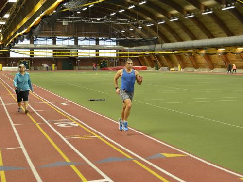 Members of the campus and community run and walk in Romney Field House