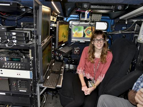 SUNY Oswego will host visit by the Doppler on Wheels high-tech mobile radar vehicle and more for STEM Community Day, from 2 to 5 p.m. on April 6. Samantha Karlsson, now a meteorology grad, sits in the Doppler on Wheels during a 2022 campus visit.