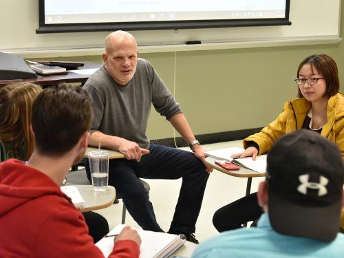 Economics professor David Andrews having class discussion