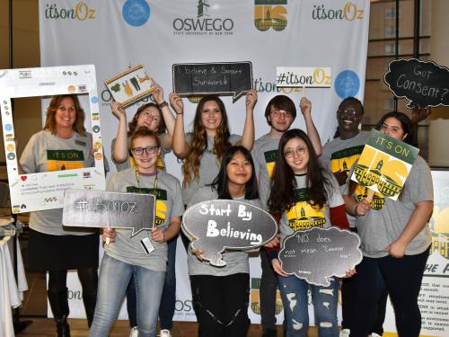 Title IX Coordinator Lisa Evaneski and students at an It's On Oz event promote the importance of consent