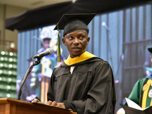 Otis Gbala is a December 2023 graduate in the master's in biomedical and health informatics program; here he speaks at December Commencement