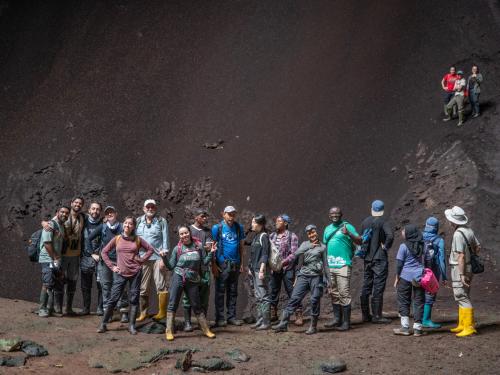 Bat researchers exploring a cave as part of the inaugural Global South workshop