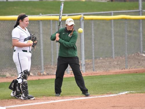 Graduate student Morgan Nandin teaching softball