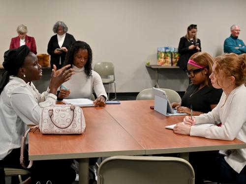 Humphrey Fellows representatives visit with members of SUNY Oswego's Cultural Environment of International Business class