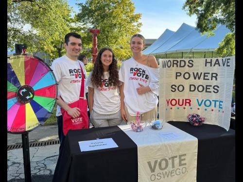 Sydney Mayer (center) tables with her peers for POL: 386: Vote Oswego.