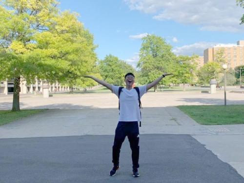 Johnson Liu, a junior computer science major from Brooklyn, shows his love for the campus