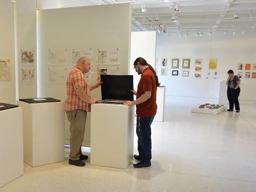 Gallery workers prepare Judith Ann Benedict art exhibition