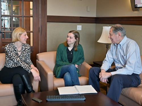  Kayla Hoyt (center), a senior human resource management major, is researching ways to mitigate and prevent microaggressions as part of her Quest research and senior honors thesis. Her advisors for the project are Kristin Sotak and Barry Friedman.