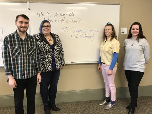 Faculty and students show off example of Kiowa language