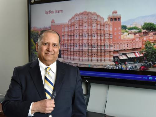 Alok Kumar with still of video he produced, this showing Hawa Mahal in Jaipur, a honeycomb structure built in 1799 that employs the Venturi effect for natural air conditioning