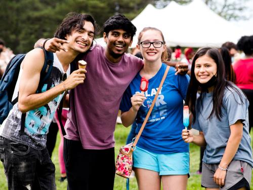 Four students pose with smiles and ice cream during 2021 LakerFest