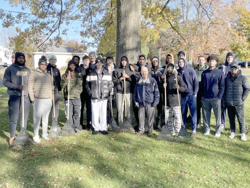 The Laker men's basketball team were among the hundreds of SUNY Oswego student-athletes raking yards for local senior citizens