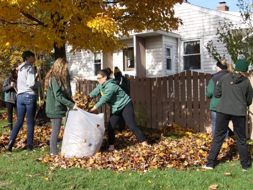Laker student-athletes raking leaves