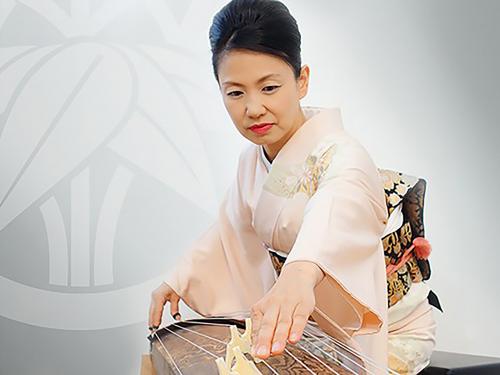 Masayo Ishigure plays a traditional Japanese horizontal harp or zither known as the koto