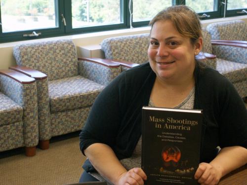 Jaclyn Schildkraut with mass shootings resource book