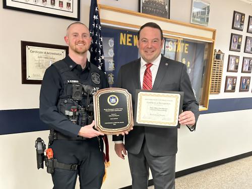 SUNY Oswego University Officer Scott Maynard (left) earned the SUNY Professional Service Award for University Police. University Police Chief Scott Swayze congratulates Maynard on this honor.