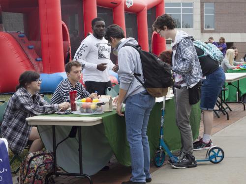 A busy table at a previous Mental Health and Wellness Fair 