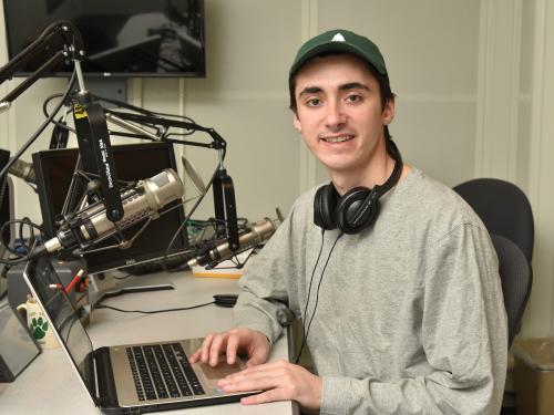 Snior journalism major Ryan Zalduondo in WRVO studios