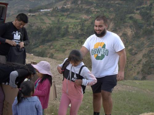 May 2024 SUNY Oswego graduate Zachary Nusimow helps distribute supplies and more to families in the Andes Mountains of Peru