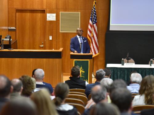 SUNY Oswego President Peter O. Nwosu, who chairs the Oswego County Micron Strategy Steering Committee, welcomes attendees to the committee's inaugural annual summit.